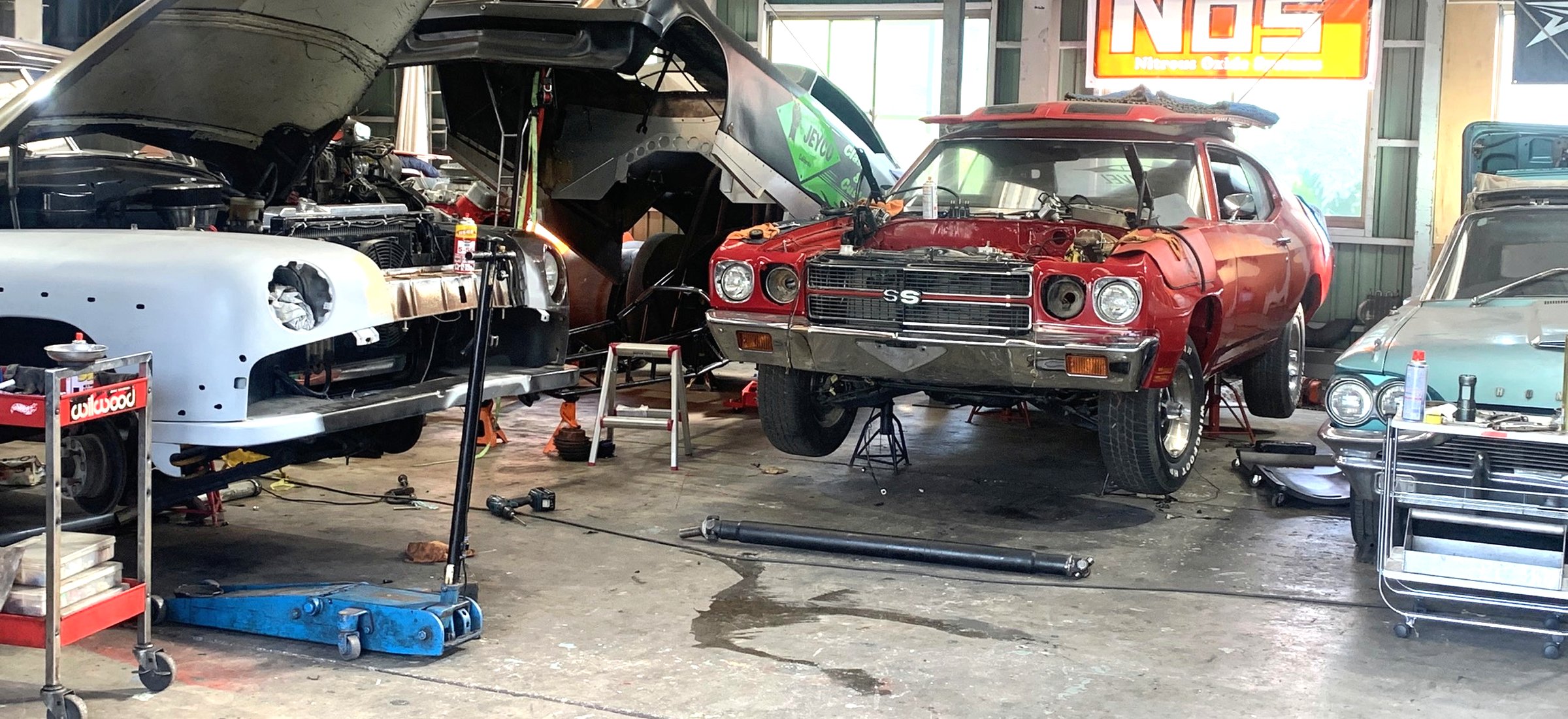 Car on lift in workshop